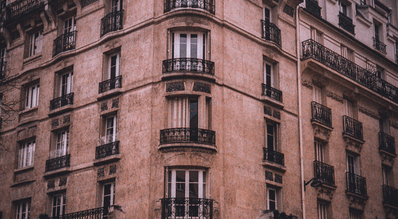 A photograph of an apartment building in Paris near the Eiffel Tower. Taken with a Nikon L35AF and Fujicolor 400 film.