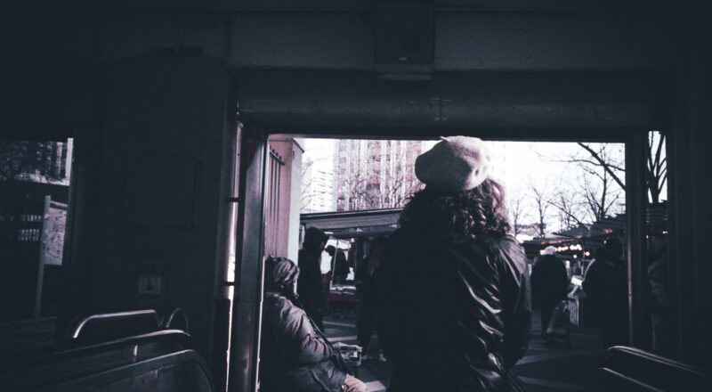 A woman exits a metro station in Paris. Taken with a Nikon L35AF using Fujicolor Colorplus 400 film.