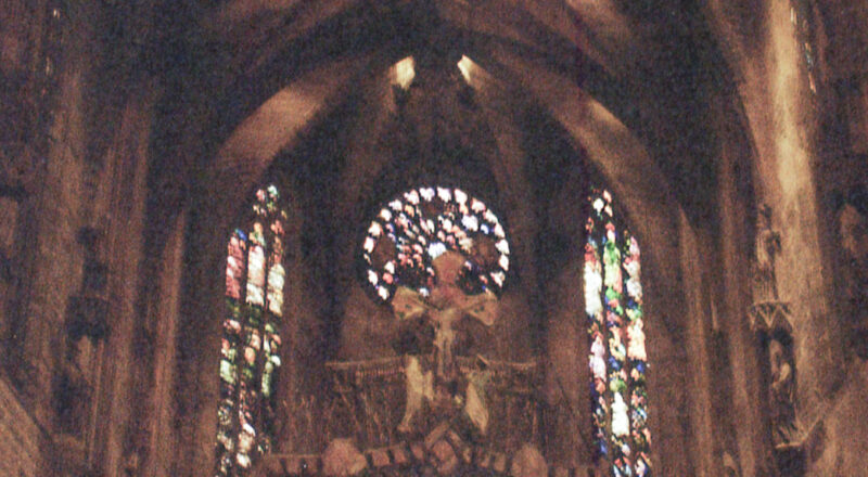 A photograph of the light shining through colored glass at the Catedral-Basílica de Santa María de Mallorca in Palma de Mallorca.