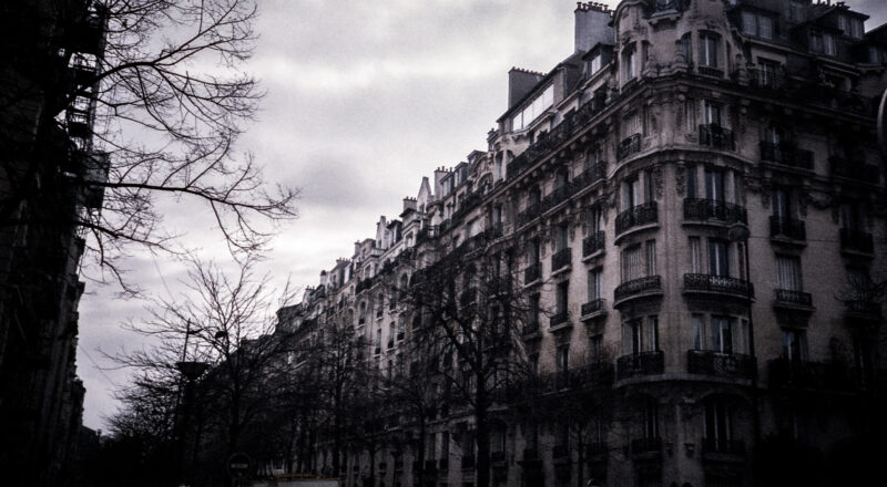 A photograph of an apartment building in Paris near the Eiffel Tower. Taken with a Nikon L35AF and Fujicolor 400 film.