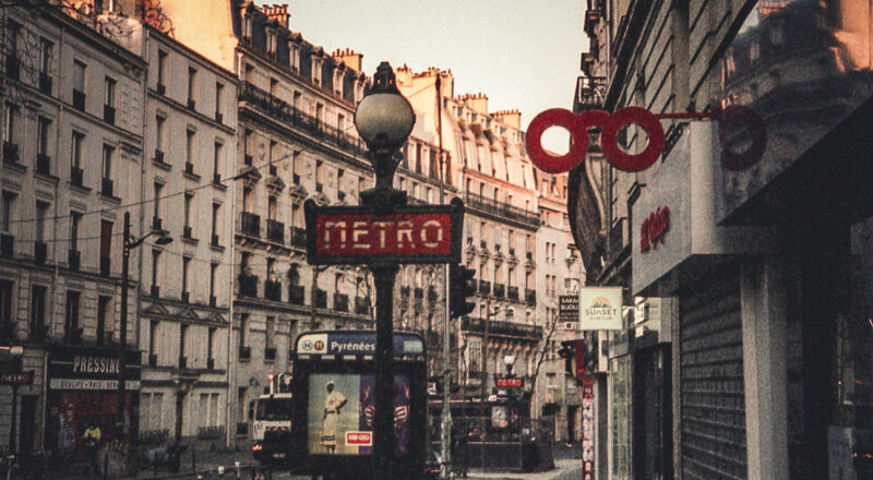 A photograph of an entrance to a Metro Station in Paris. Taken with a Nikon L35AF using Fujicolor Colorplus 400 film.