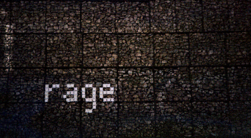 A photograph of graffiti on a sidewalk in Paris. Taken with a Nikon L35AF using Fujicolor Colorplus 400 film.