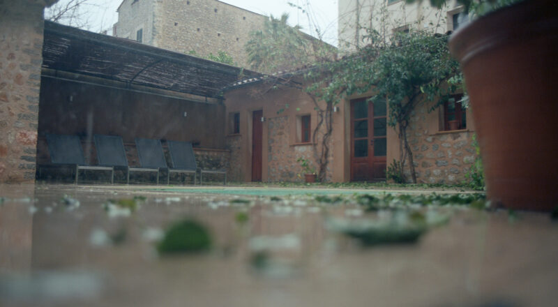 A photograph of the rear area of a villa in Soller de Mallorca during the rain. Taken with a Canon F1New with Kodak Gold 200 film.