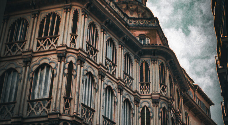 A photograph of buildings in a shopping district of Palma de Mallorca.