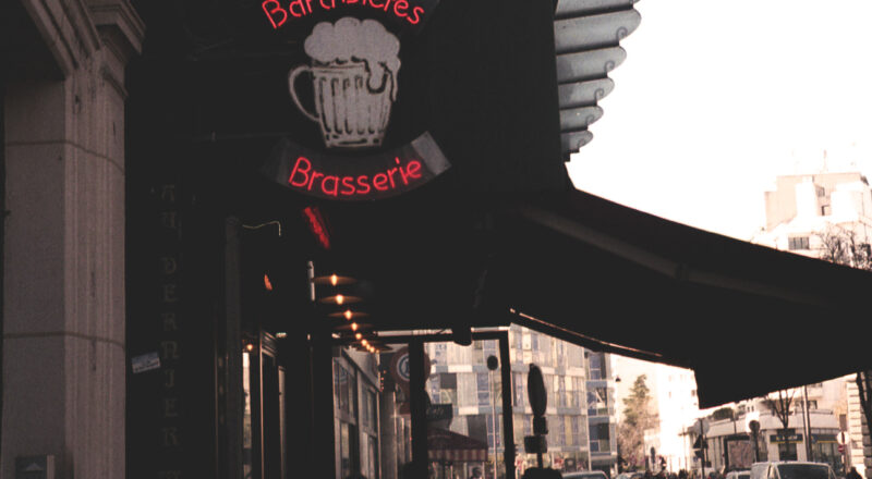 A photograph of the outside of a brasserie in Paris. Taken with a Nikon L35AF and Fujicolor 400 film.