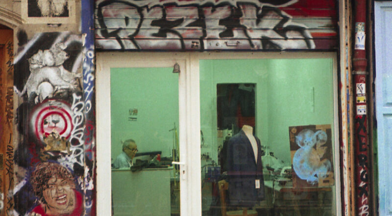 Retoucherie de Paris. A photograph of a man working late at his tailor shop in Paris' Belleville neighborhood. Taken with a NIkon L35AF using Fujicolor Colorplus 400 film.