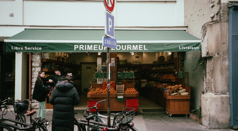 A photograph of the Primeur Lourmel fruiterie in Paris. Taken with a Nikon L35AF and Fujicolor 400 film.