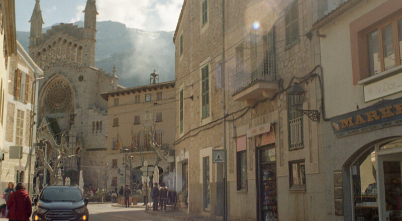 A photograph of the tramway on a narrow street in Soller de Mallorca. Taken with a Canon F1New camera and Kodak Gold 200 film.