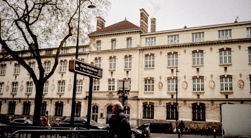 A photograph of a row of buildings in Paris. Taken with a Nikon L35AF using Fujicolor Colorplus 400 film.