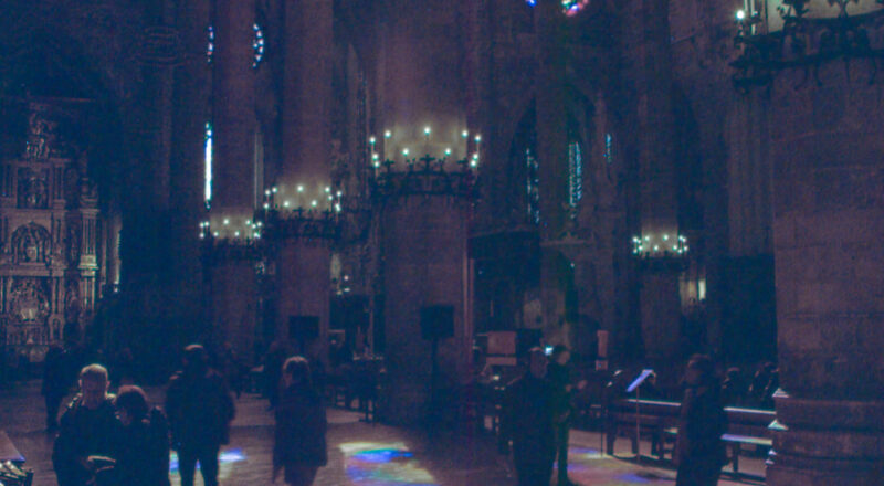 A photograph of the light shining through colored glass at the Catedral-Basílica de Santa María de Mallorca in Palma de Mallorca.