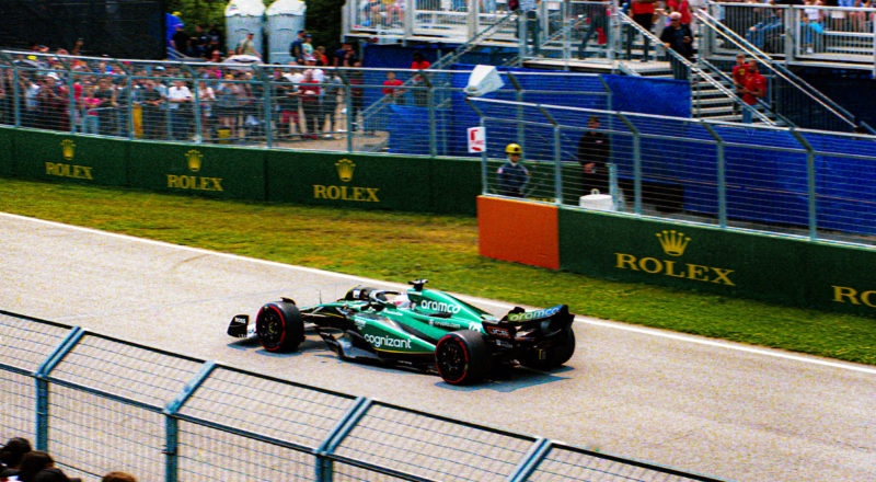 A photograph of Aston Martin driver, Lance Stroll, during the qualifying round of the 2023 Canadian Grand Prix in Montreal at the Circuit Jacques Villeneuve. Taken with a Canon F1New film camera using Kodak Ektar 100 Professional film.