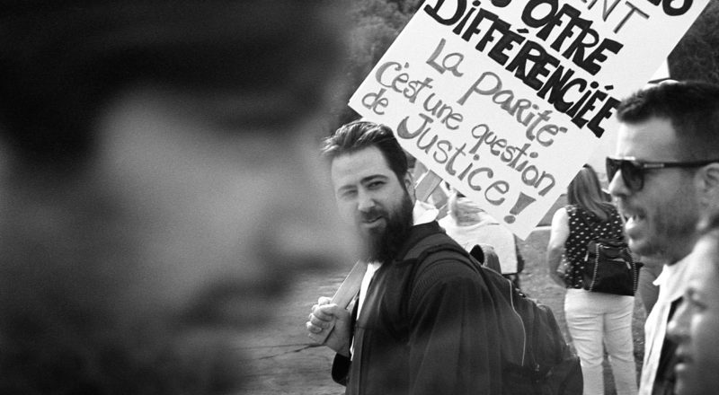A photograph from a union rally in support of Quebec service workers including teachers and nurses near the Sir George-Etienne Cartier Monument in Montreal during the summer of 2023. Taken with a Canon F1New using CatLabs 320 film.
