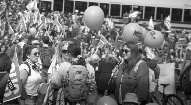 A photograph from a union rally in support of Quebec service workers including teachers and nurses near the Sir George-Etienne Cartier Monument in Montreal during the summer of 2023. Taken with a Canon F1New using CatLabs 320 film.