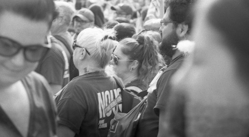 A photograph from a union rally in support of Quebec service workers including teachers and nurses near the Sir George-Etienne Cartier Monument in Montreal during the summer of 2023. Taken with a Canon F1New using CatLabs 320 film.