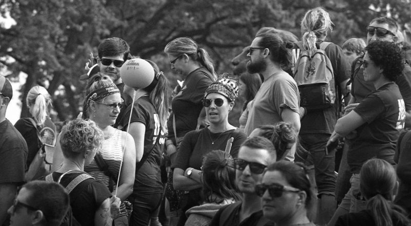 A photograph from a union rally in support of Quebec service workers including teachers and nurses near the Sir George-Etienne Cartier Monument in Montreal during the summer of 2023. Taken with a Canon F1New using CatLabs 320 film.