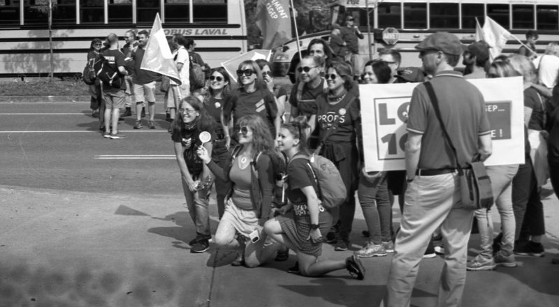 A photograph from a union rally in support of Quebec service workers including teachers and nurses near the Sir George-Etienne Cartier Monument in Montreal during the summer of 2023. Taken with a Canon F1New using CatLabs 320 film.