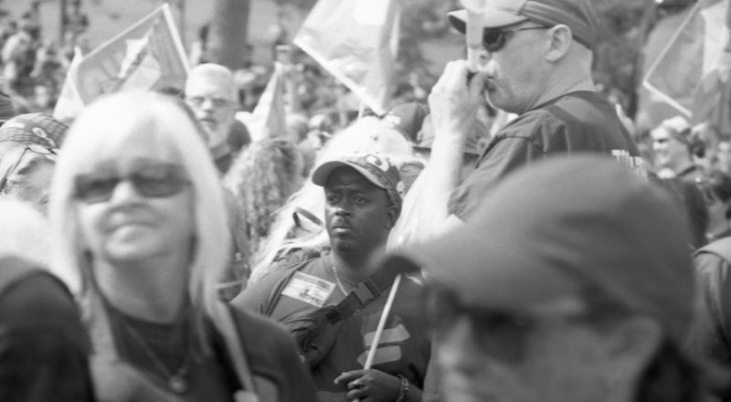 A photograph from a union rally in support of Quebec service workers including teachers and nurses near the Sir George-Etienne Cartier Monument in Montreal during the summer of 2023. Taken with a Canon F1New using CatLabs 320 film.