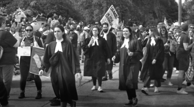 A photograph from a union rally in support of Quebec service workers including teachers and nurses near the Sir George-Etienne Cartier Monument in Montreal during the summer of 2023. Taken with a Canon F1New using CatLabs 320 film.