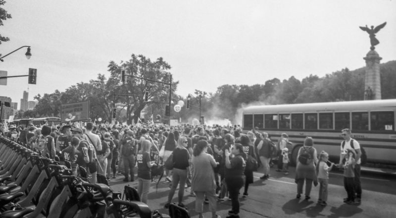 A photograph from a union rally in support of Quebec service workers including teachers and nurses near the Sir George-Etienne Cartier Monument in Montreal during the summer of 2023. Taken with a Canon F1New using CatLabs 320 film.