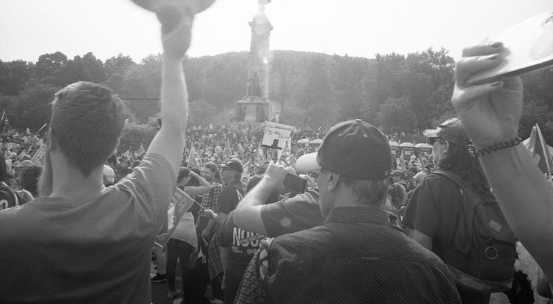 A photograph of protestors from a union rally in support of Quebec service workers including teachers and nurses near the Sir George-Etienne Cartier Monument in Montreal during the summer of 2023. Taken with a Canon F1New using CatLabs 320 film.