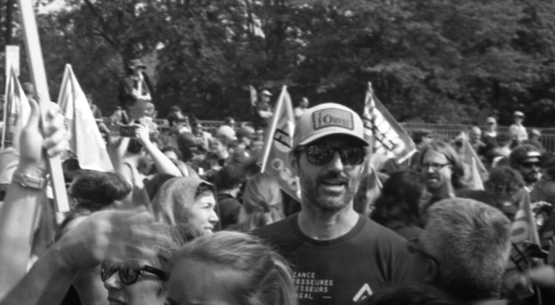 A photograph of protestors from a union rally in support of Quebec service workers including teachers and nurses near the Sir George-Etienne Cartier Monument in Montreal during the summer of 2023. Taken with a Canon F1New using CatLabs 320 film.