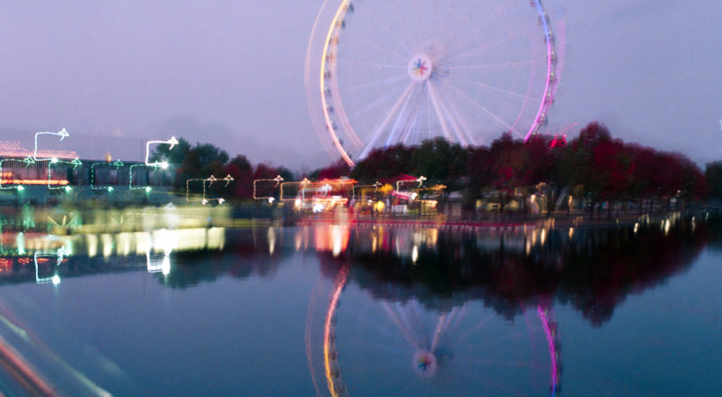 Montreal's Old Port and the ferris wheel photographed at the golden hour using a Mamiya M645 1000S and Portra 800 film.