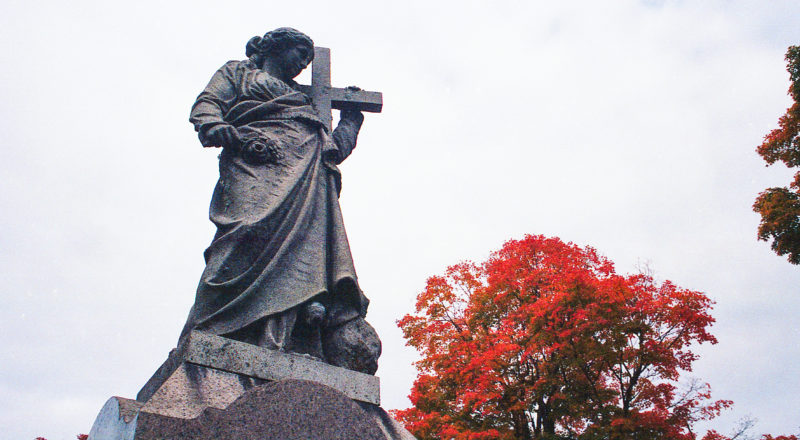 A photograph of a statue in the Mont Royal Cemetery